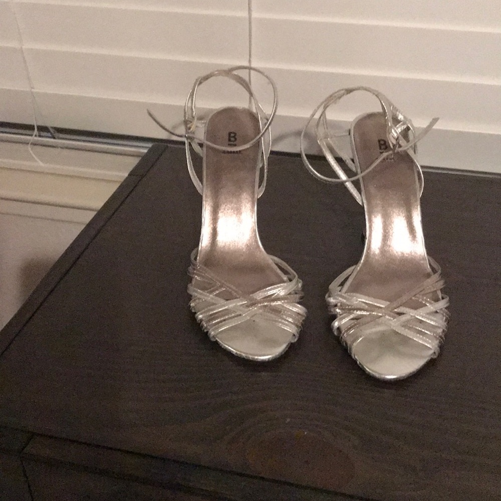 Silver wedge heels.